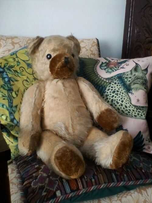 vintage hard straw stuffed teddy bear. Sparse mohair fur.