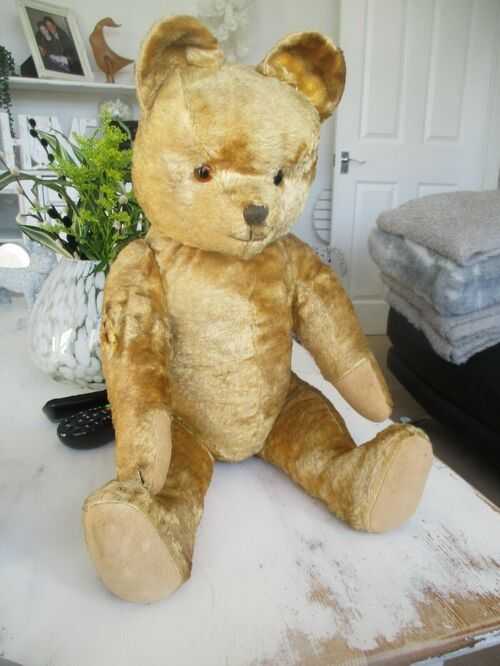 beautiful antique jointed straw filled teddy bear with growler golden mohair..