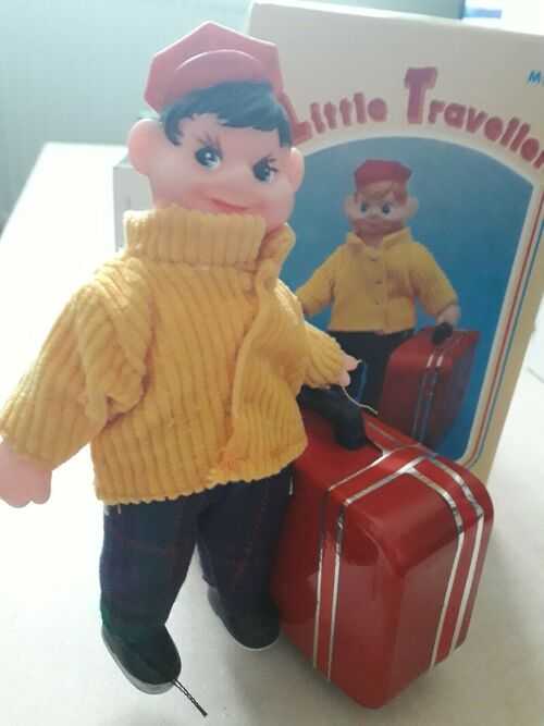 Clockwork wind up Little Traveller boy with suitcase