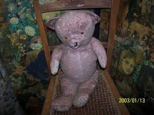 A antique/Vintage bear.  for restoration. Straw filled pink bear.