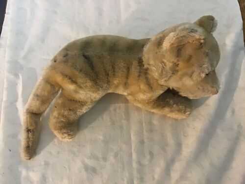 Antique straw filled  tiger, glass eyes 41 cms in length good condition