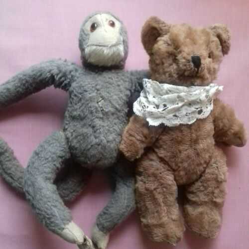 Antique teddy bear and monkey