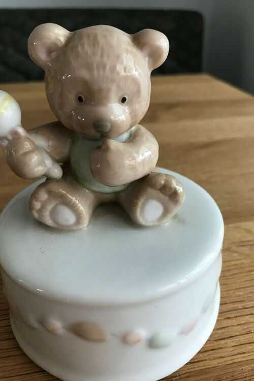 Small teddy bear holding rattle musical ornament 12cm x 9cm