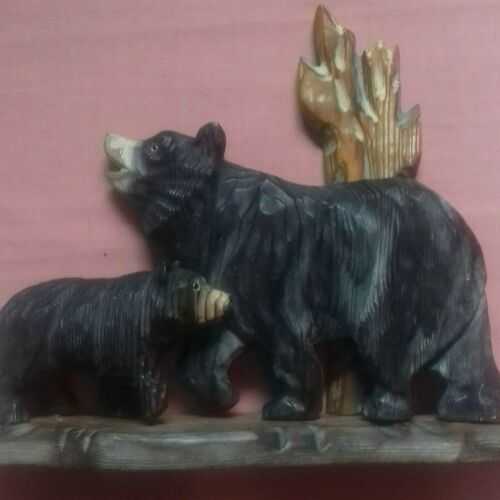 Vintage carved wooden ornament with two bears