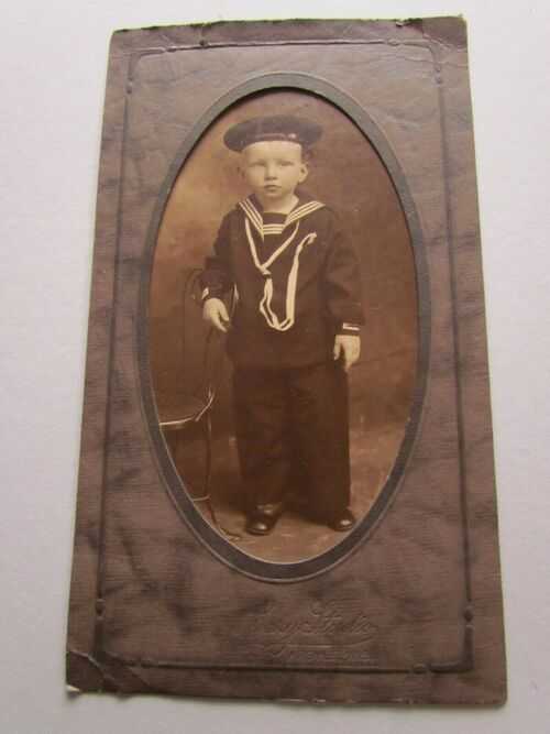 ANTIQUE PHOTO POSTCARD FEATURING LITTLE BOY IN TRADITIONAL SAILOR SUIT