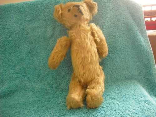 Antique Teddy Bear with articulated limbs unusually long body.