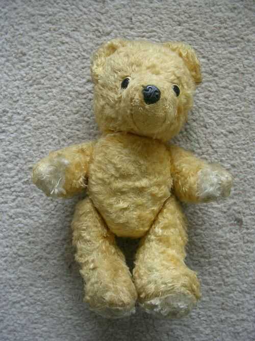 A VINTAGE  SMALL JOINTED TEDDY BEAR.