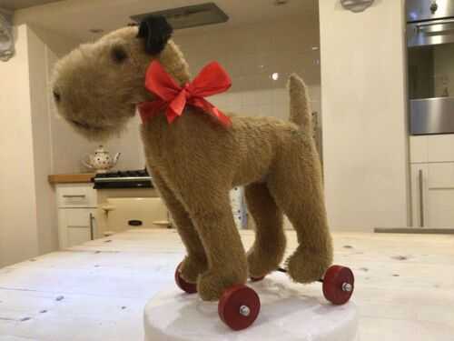 Vintage dog on wheels fox/Irish terrier on wheels,mohair toy dog,Stanley dog