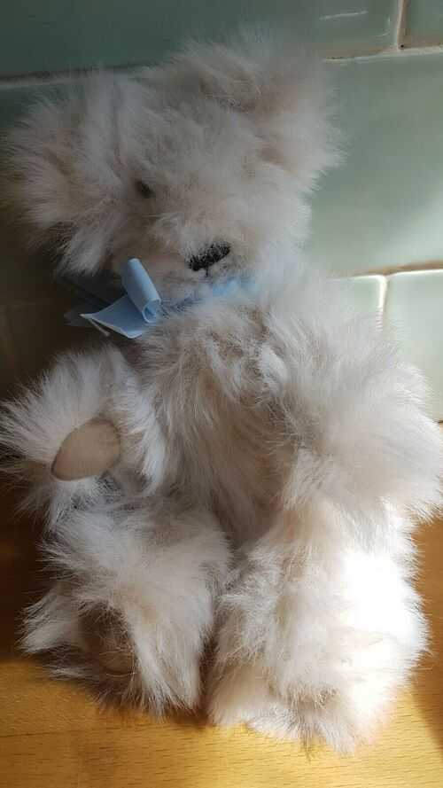Small very cute jointed teddy bear with suede padded feet